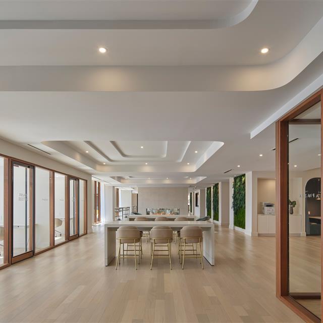 A view of a workspace with tables and chairs