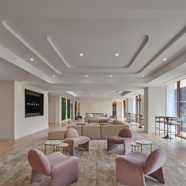 A lounge with chairs and sofas